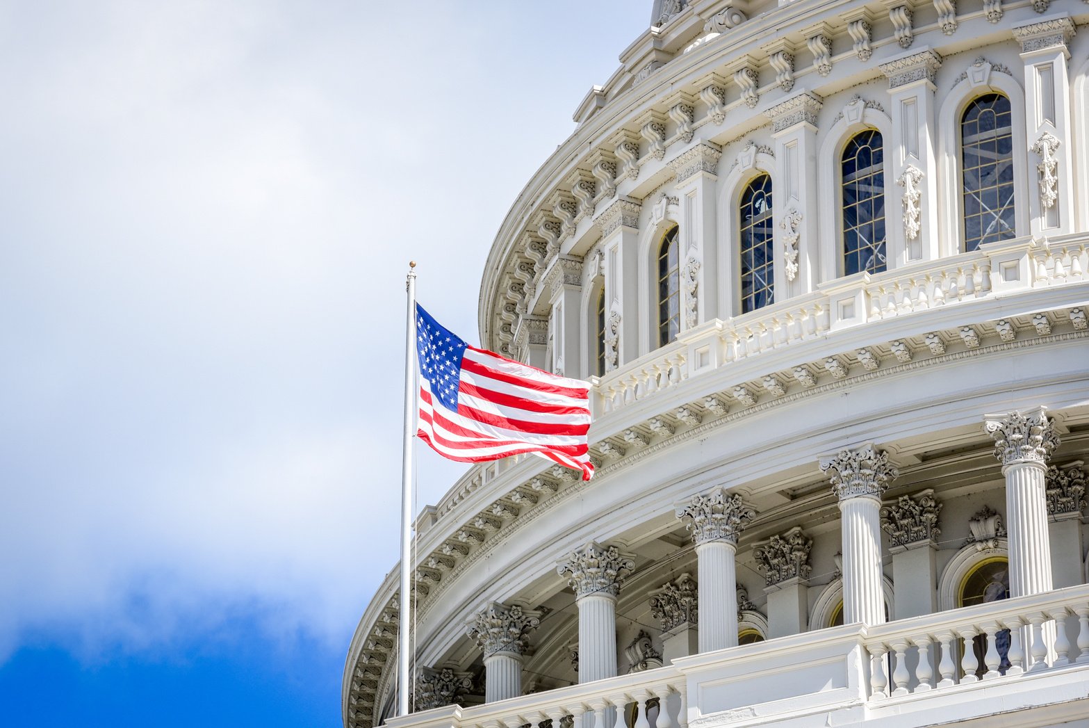 Capitol building in Washington DC with USA flag